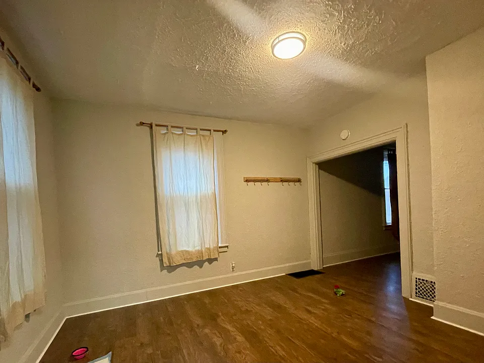 Dining room area next to kitchen and spacious living room.