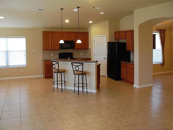 Living room opens to kitchen