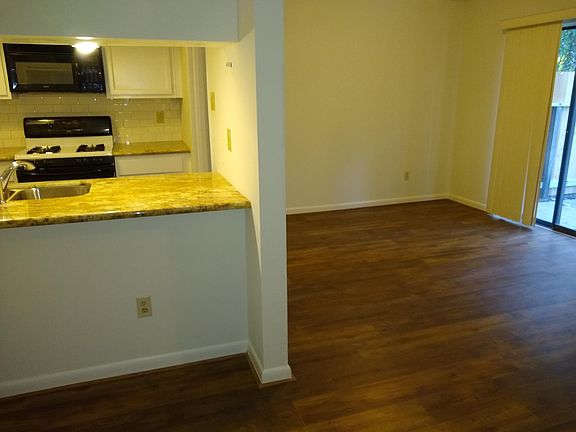 Kitchen with all appliances, gas stove, granite counters, high end laminate flooring