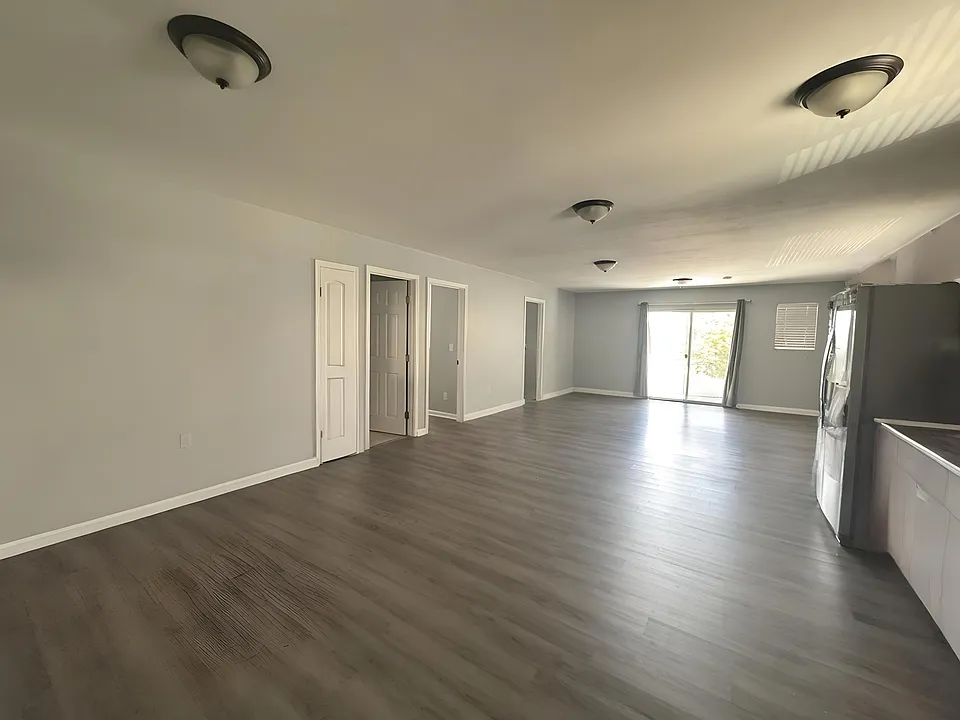UPSTAIRS -LIVING/KITCHEN AREA W 3 BEDS 2 BATH TO THE LEFT DOORS