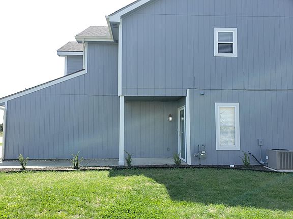 Side of house. View of front door entryway.