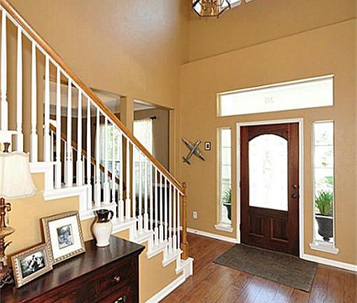 Impressive two-story foyer with an abundance of natural light.