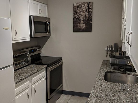 Fully Equipped Kitchen with Granite Counter-tops & Stainless