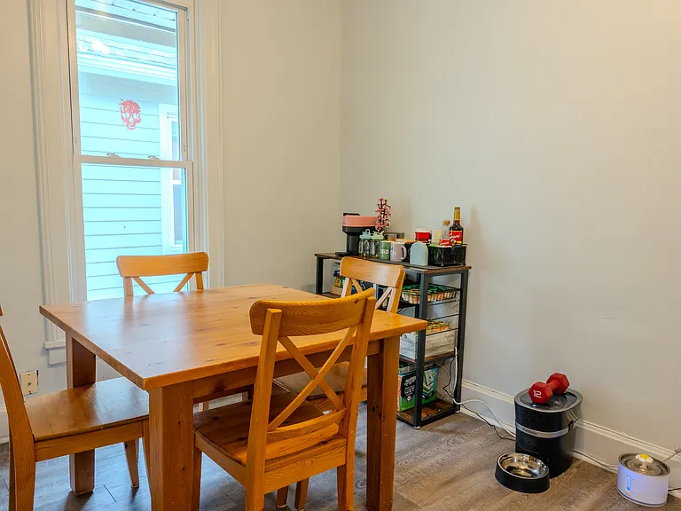Enjoy meals in this spacious dining room with a window.