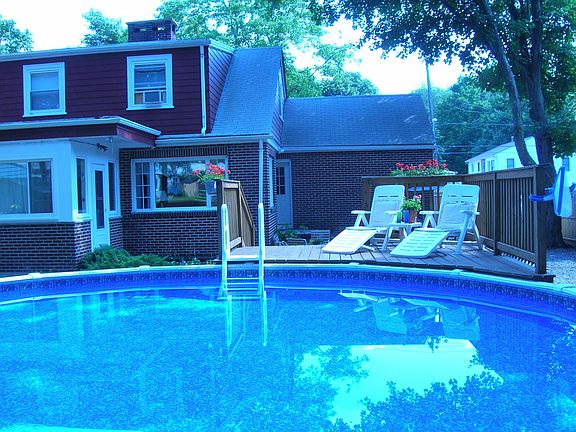 Pool with extensive deck and patio.