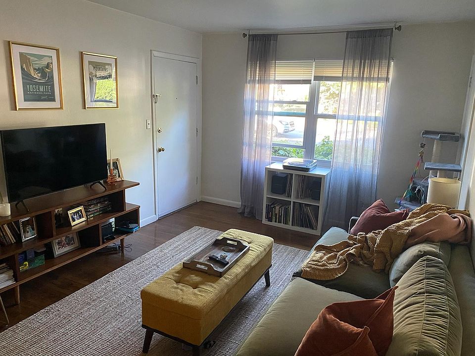 living area which includes front window, open to kitchen area, hall are which is to front door and coat closet. lots of good light.