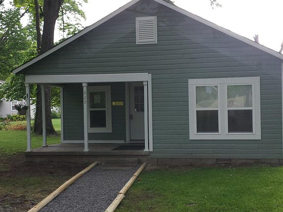 Front of the home with covered porch.