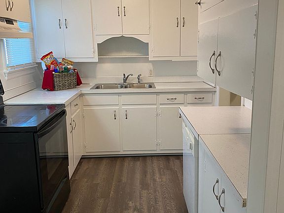 Fully fresh painted kitchen with new flooring and plenty of cabinet space. Electric stove and dishwasher included.