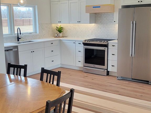 Spacious open concept kitchen, dining and living room.