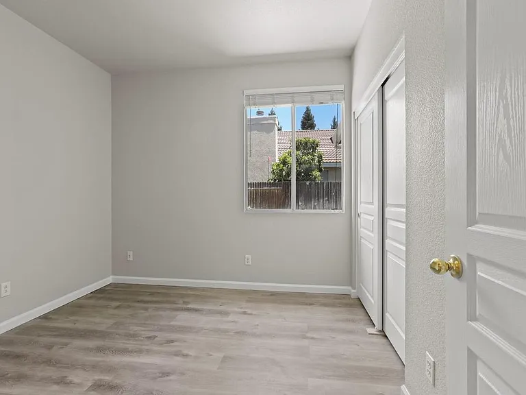 Bedroom #1 with recessed lightning, window blinds, and closet