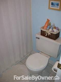 Main Bathroom : Toilet and shower seperated from sinks with a door!