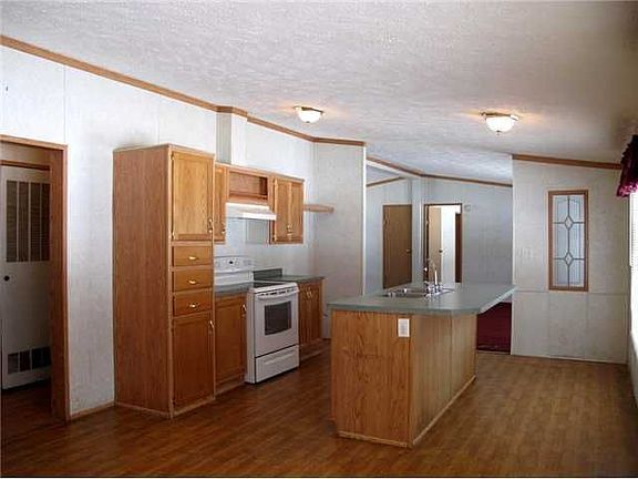Kitchen: Center of Kitchen offers a large Center Island.