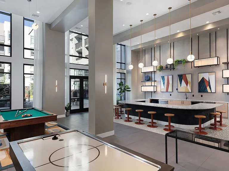 Clubroom with game area and entertaining kitchen
