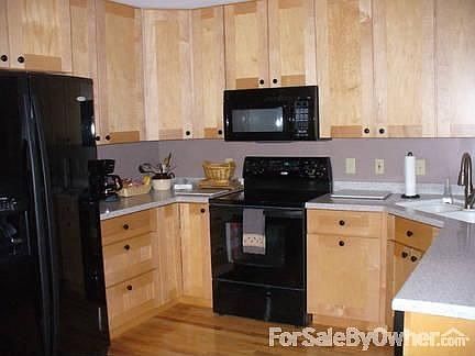 Kitchen.
						:
						New maple cabinets, hardwood floor, Corian counters, all drawers.