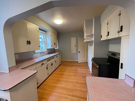 All original cabinets, even a pull down ironing board in the wall!!