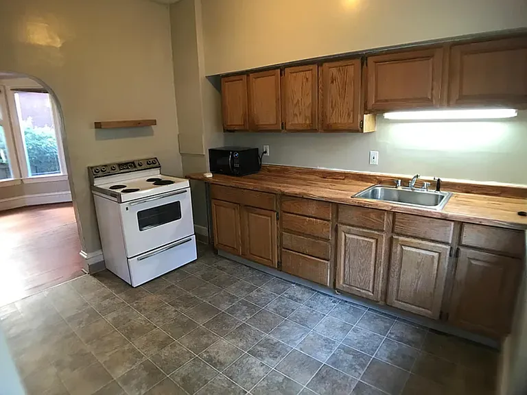not pictured: new solid surface countertop and sink