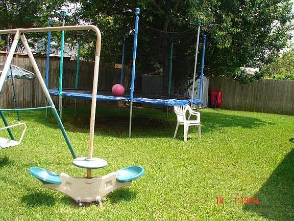 Swing Set, Trampoline, and Storage Shed. 
