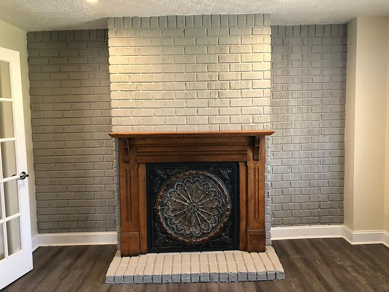 Decorative fireplace in front den