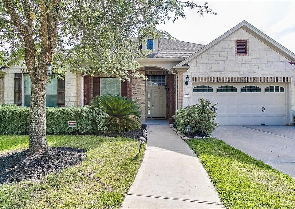 Welcome Home! 5527 Lacey Oak Meadow Drive is conveniently located in the Master Planned Community of Seven Meadows on a premium lot facing one of the neighborhoods best parks & swimming pools. Walk to  swim meets and practices for the Seven Meadows Sailfish Swim Team!