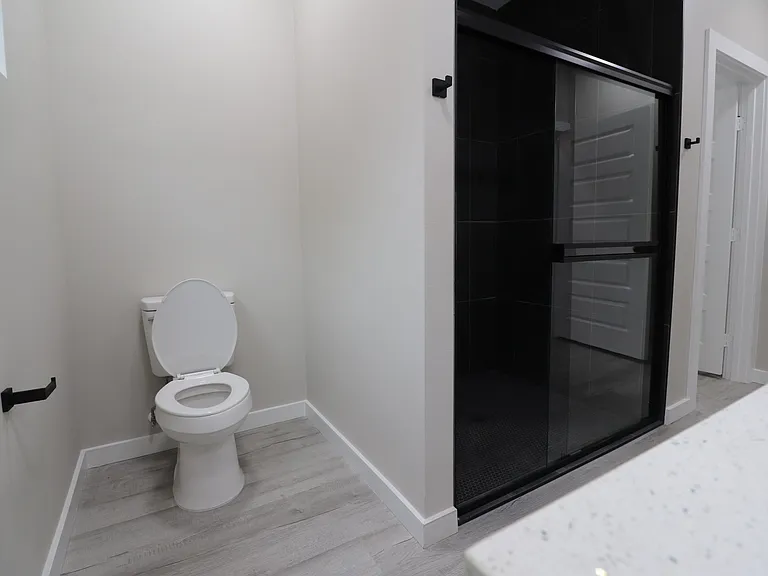 Separate toilet area offering privacy and modern design.