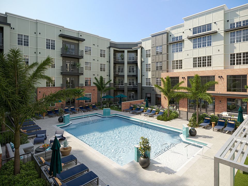 Sparkling Swimming Pool with Cabanas and Lounge Chairs