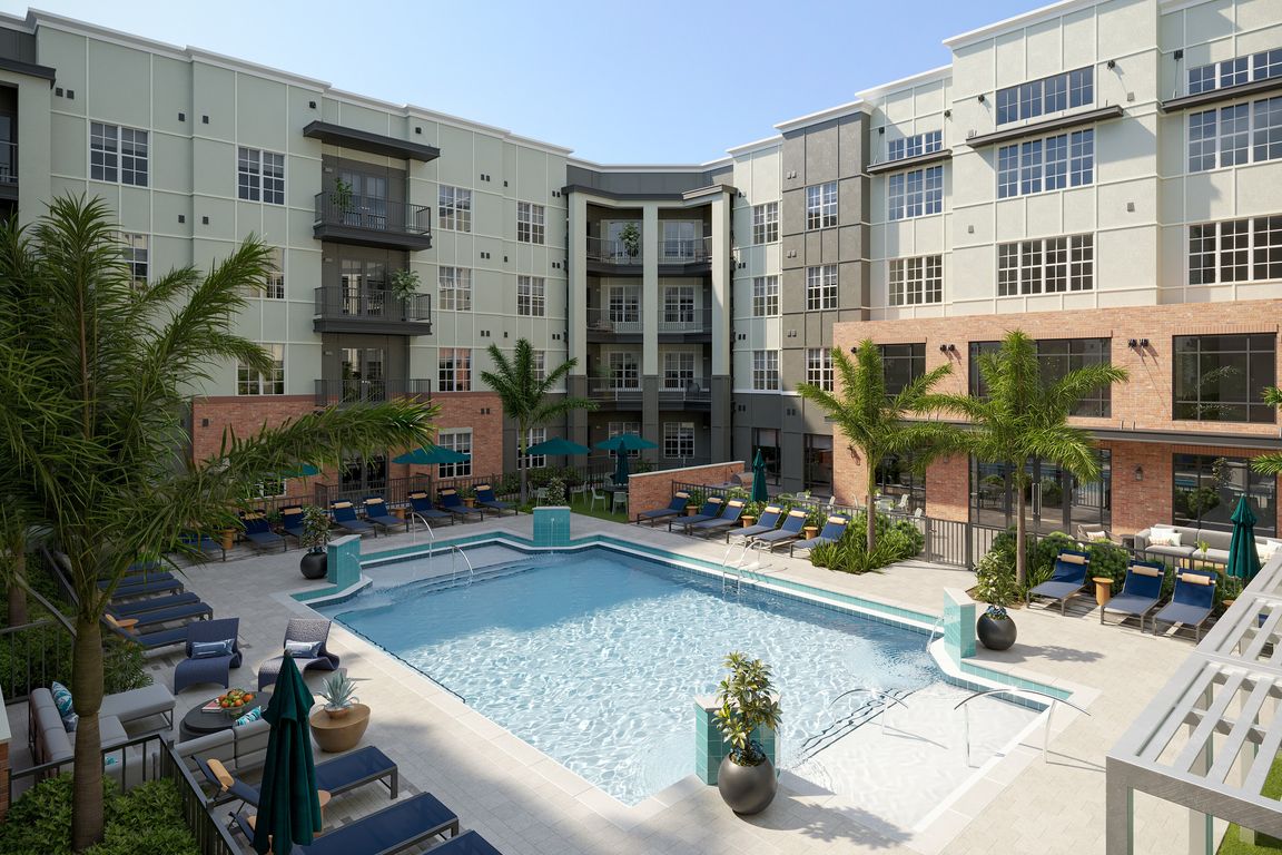 Sparkling Swimming Pool with Cabanas and Lounge Chairs