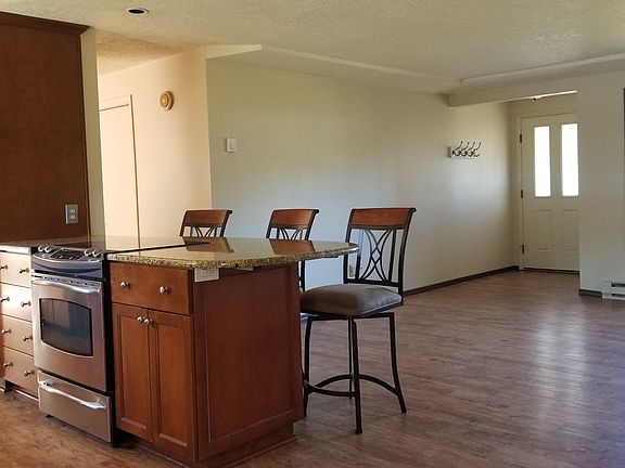 Granite island opens to living room and garden views