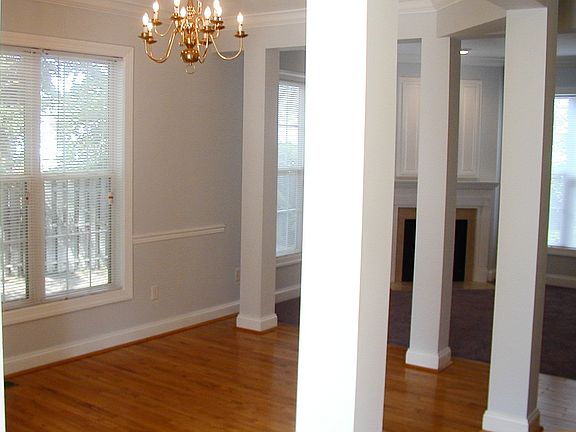 Hardwood floors in Foyer, Hall and Dining area