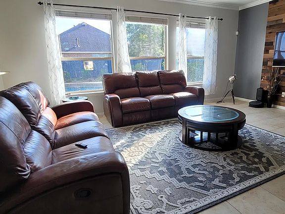 Living Room view to the backyard Swimming Pool