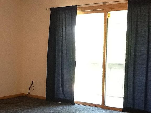 Balcony doors let in plenty of light to good-sized living room