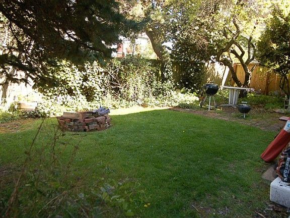 Fenced rear yard belongs to unit #1.