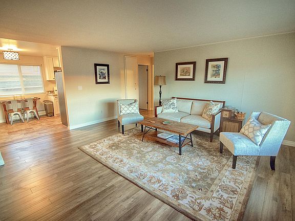 Living Room looking into kitchen (different unit but same layout)