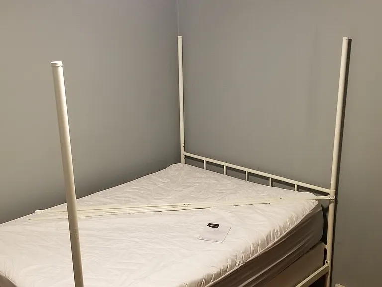queen size bed from previous roommate for scale