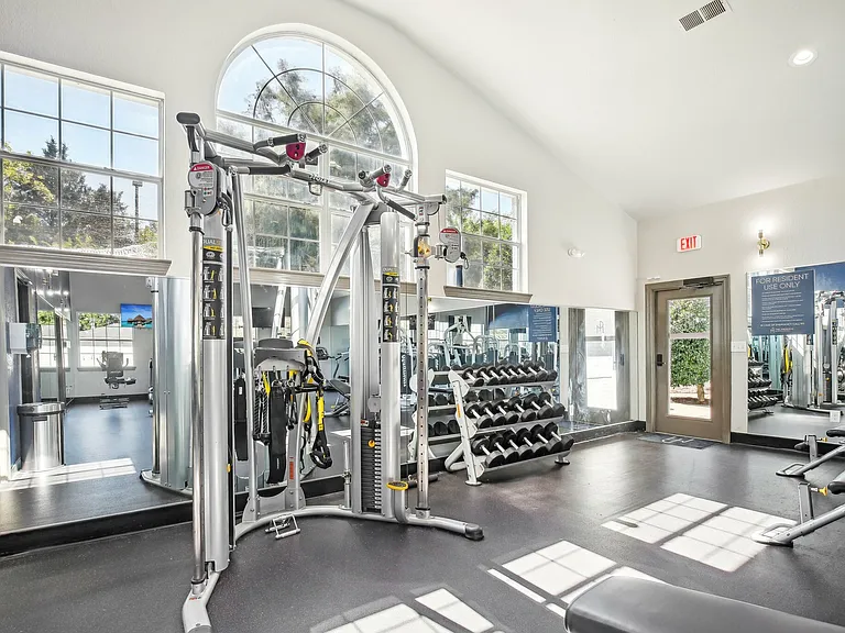 Stay fit with a fully equipped fitness center featuring strength training machines and cardio equipment at The Preserve Murfreesboro.