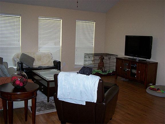 Family room, with lots of windows that overlook the backyard.