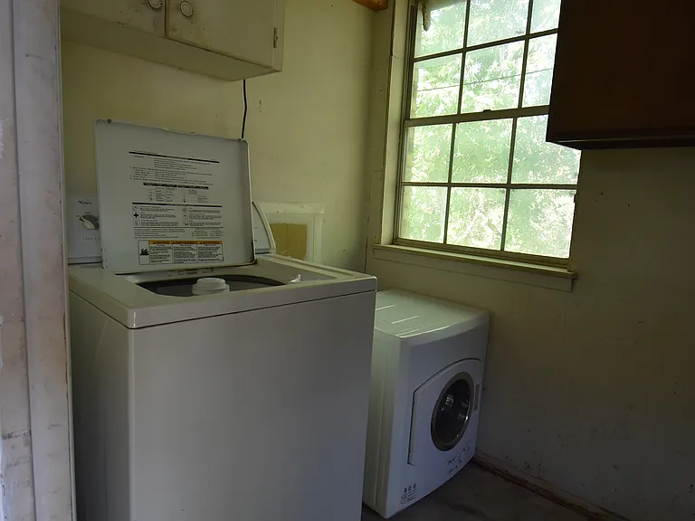 Washer and Dryer available in a private laundry room located off the garage