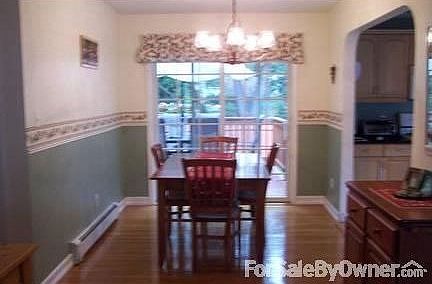 Dining room : Bright dining room with sliding glass door to oversided 12 x 24 ft deck.