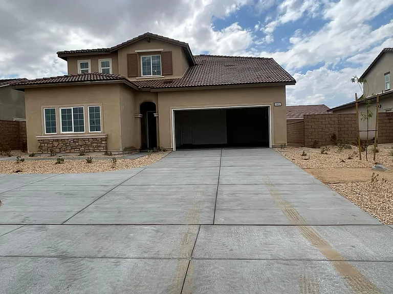 Front of the house and additional driveway parking