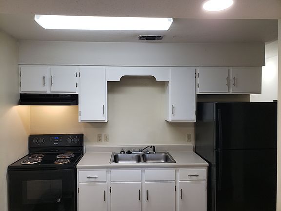 Kitchen with newly refinished cabinets