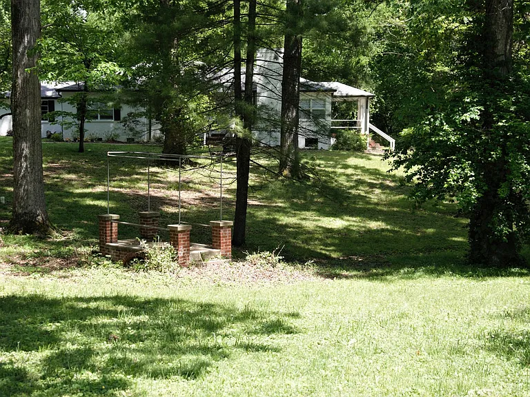 Home is nestled in a clearing among dappled shade with great peace and privacy