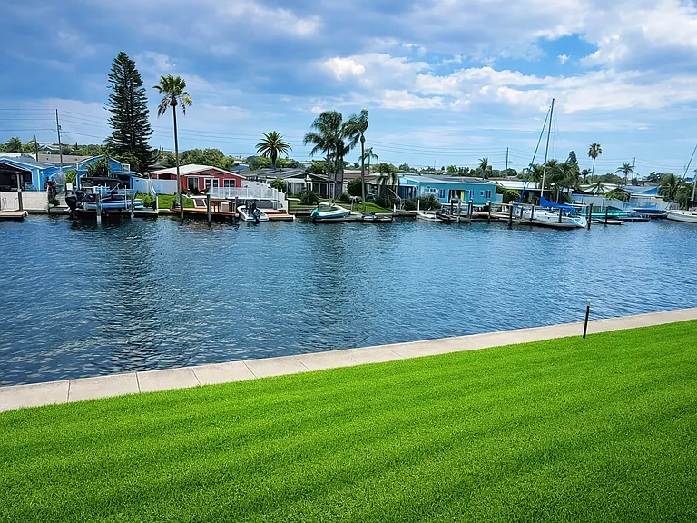 Enjoy waterfront views from the expansive Florida room everyday.
You can see sailboats, dolphins and even manatees swimming past you.