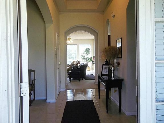 Tile Flooring and Pretty Arches in Front Entry