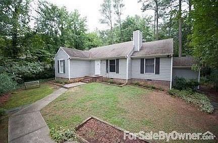 Front of House
						:
						All new bushes in front of house; path leading to back on right side