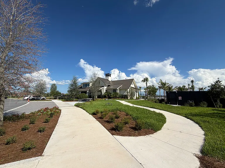 BRAND NEW 2ND CLUBHOUSE WALKING DISTANCE WITH SKATE PARK, PICKLEBALL, PLAYGROUND WITH ZIP LINING, HEATED POOL WITH SUNSHELF ON MILE LONG LAKE WITH 2 DOG PARKS.
