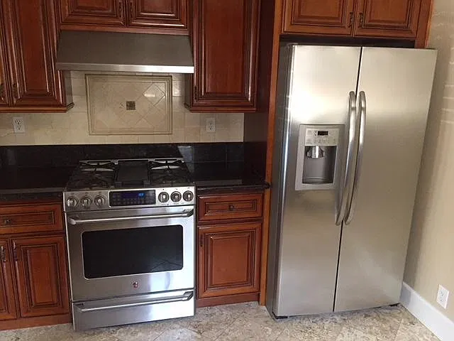 Kitchen with granite counters and stainless steel appliances