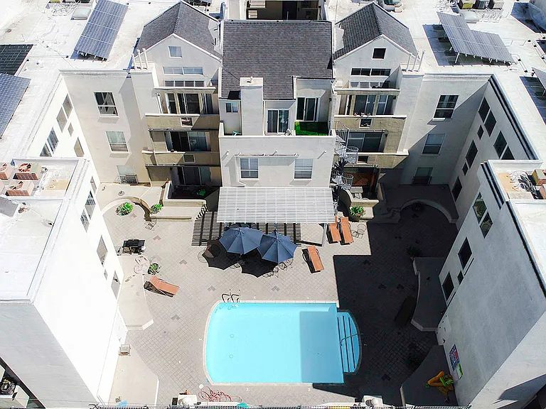 Drone image of the pool and roofs with white solar coating to lower our carbon footprint.
