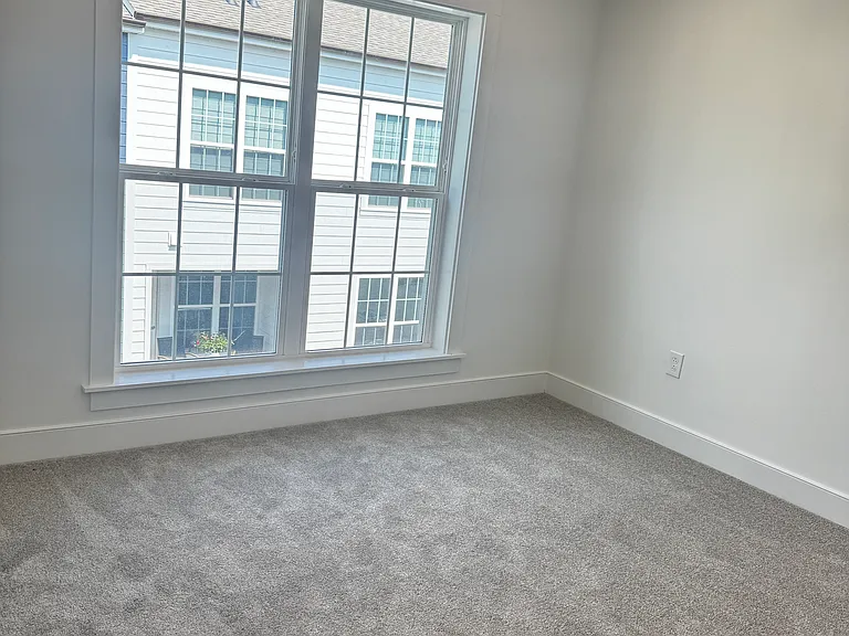 Accessory bedroom on top floor with attached full bathroom