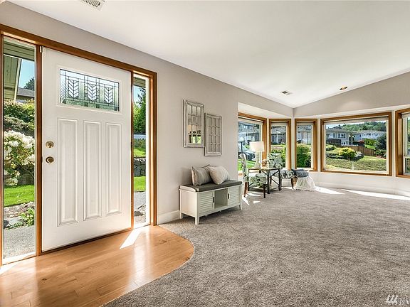 Picture windows allowing plenty of natural light to flow through the home.