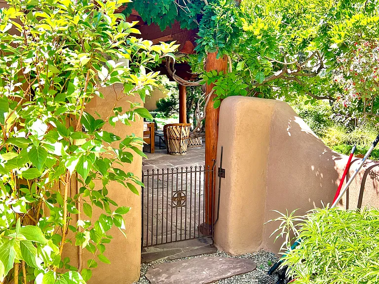 Gate to garden entrance from private off-street parking area