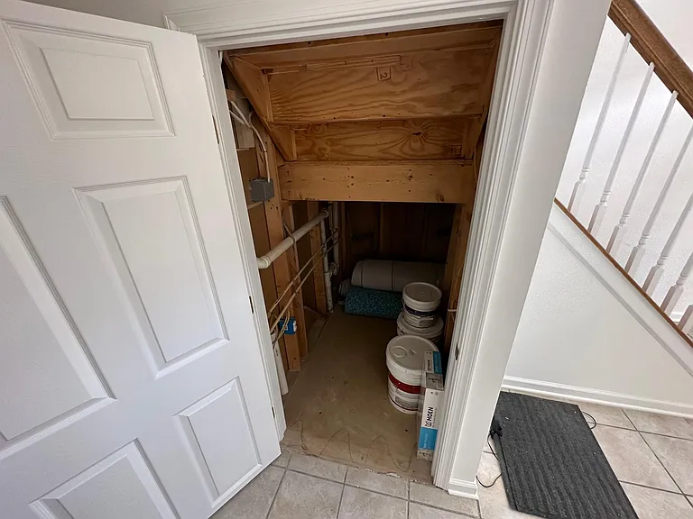 Additional storage is available under the stairs on the lower level
